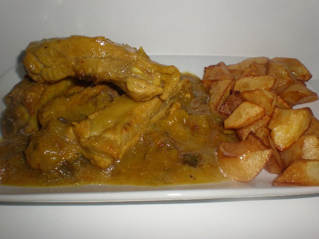 Costillas de cerdo en salsa de cebollas tiernas 